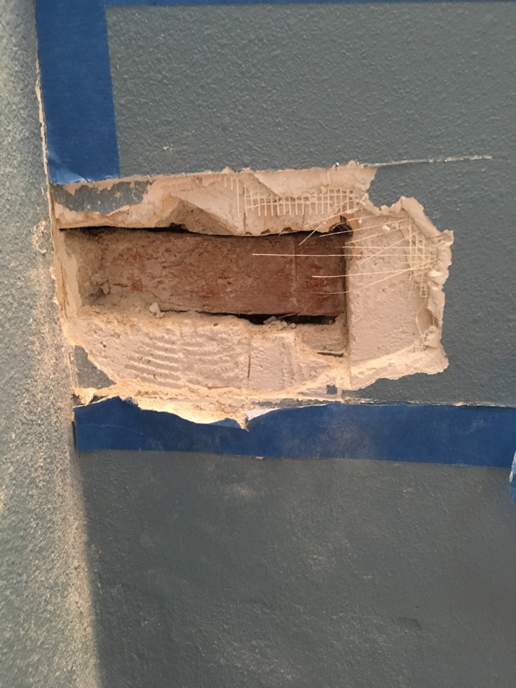 Close-up of plaster removal